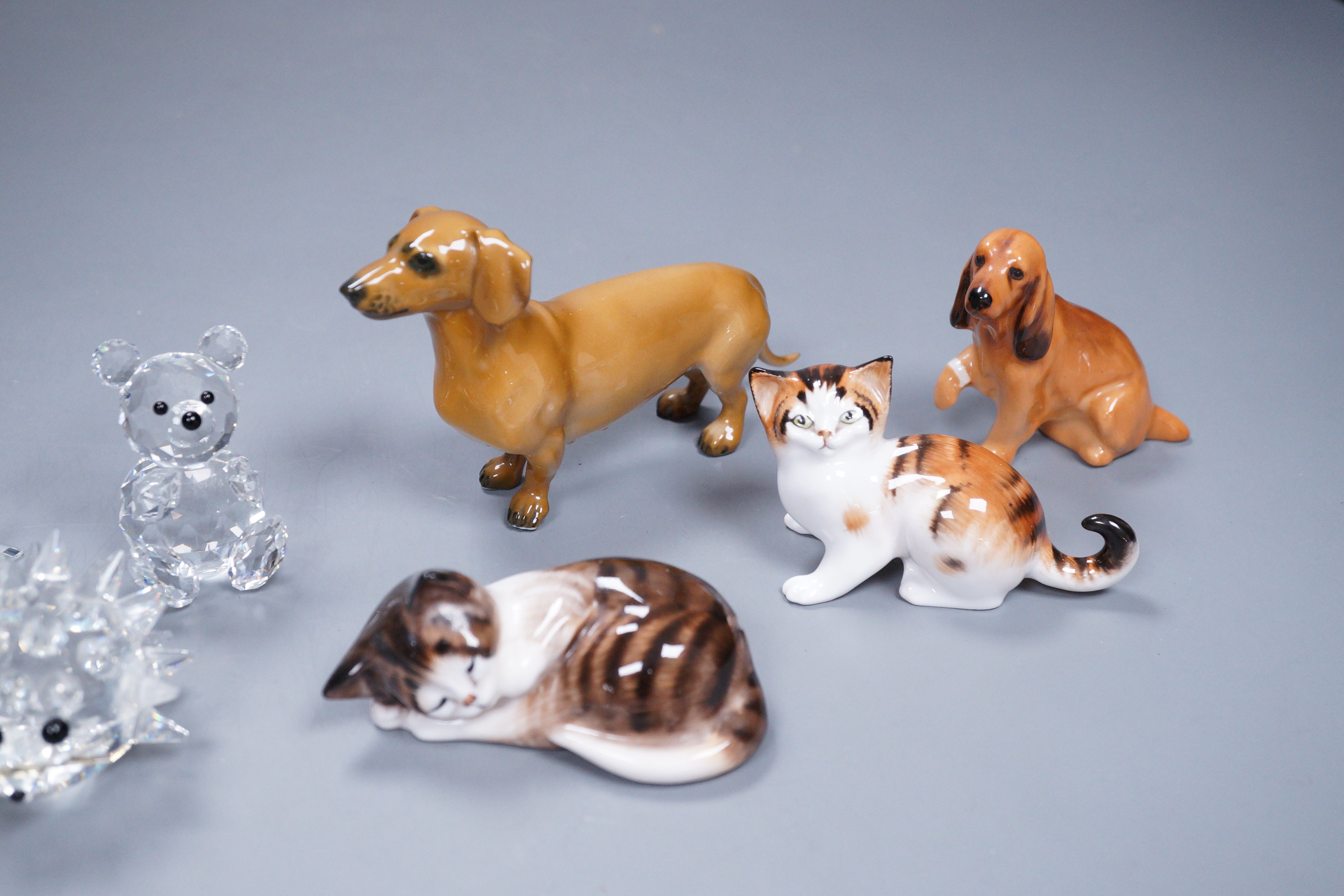 A group of Swarovski crystal (5) and four porcelain animal models, three Doulton and one Rosenthal